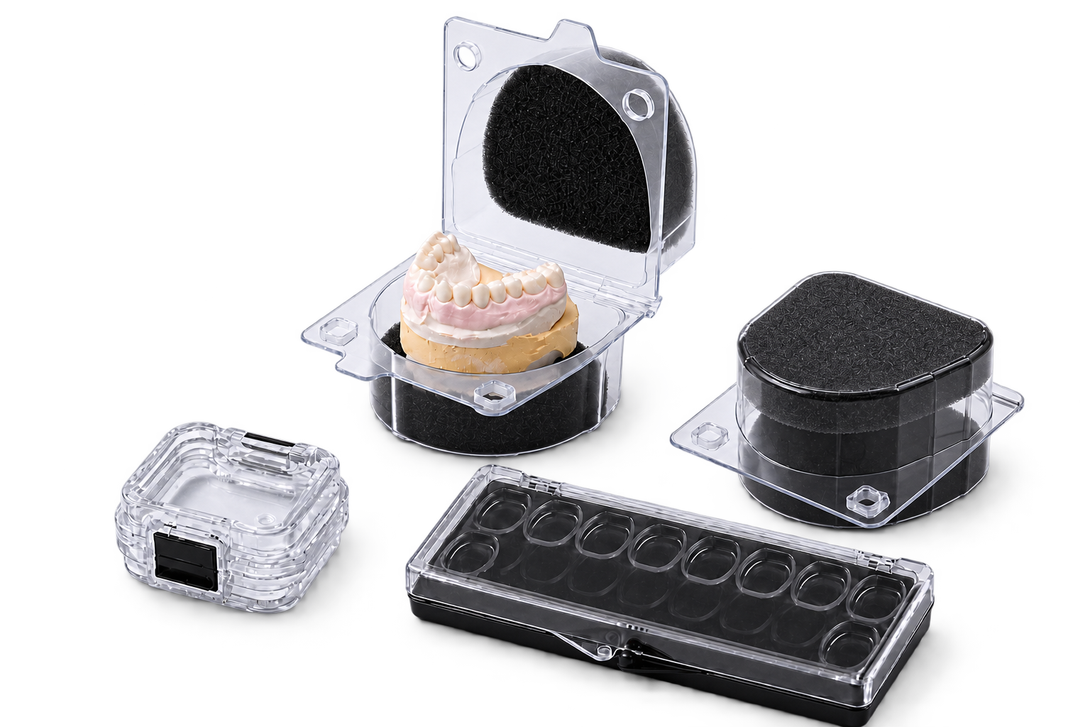 Four clear dental packaging boxes, including an open model box, a closed model box, a small crown box and a veneer box
